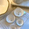 Inspire Me! Home Decor 4 Piece White With Gold Trim Measuring Cups Discount